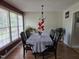 Formal dining room with wood floors and large windows providing natural light at 5810 Stardust Ct, Durham, NC 27712
