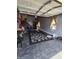 Spacious two-car garage with open ceiling and a checkered rug on the floor at 5810 Stardust Ct, Durham, NC 27712
