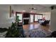 Inviting living room with a brick fireplace, wood floors, and lots of natural light at 5810 Stardust Ct, Durham, NC 27712