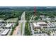 Aerial view showcases property location and proximity to local highway at 601 Country Ln, Holly Springs, NC 27540