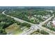 An aerial view highlights the property's accessibility to the nearby road and other local amenities at 601 Country Ln, Holly Springs, NC 27540