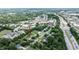 An aerial view shows the property's proximity to local shopping and nearby businesses at 601 Country Ln, Holly Springs, NC 27540
