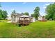 Wide backyard showcasing well-maintained lawn, deck, and the house at 601 Southampton Dr, Knightdale, NC 27545