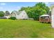 Backyard displaying green lawn, a deck, and the home's exterior at 601 Southampton Dr, Knightdale, NC 27545