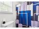 Full bathroom featuring patterned shower curtain and window at 601 Southampton Dr, Knightdale, NC 27545