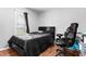 Bedroom showcasing wood-look flooring, and a dark bed set at 601 Southampton Dr, Knightdale, NC 27545