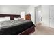 Well-lit bedroom with plush carpet and access to an ensuite bathroom at 601 Southampton Dr, Knightdale, NC 27545