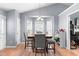 Cozy dining area with a wooden table, seating for four, and bright natural light at 601 Southampton Dr, Knightdale, NC 27545