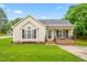 Charming single-story home with a welcoming front porch, green lawn, and classic siding at 601 Southampton Dr, Knightdale, NC 27545