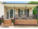 Inviting front porch with brick foundation, stylish seating and welcoming decor at 601 Southampton Dr, Knightdale, NC 27545
