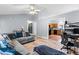 Open-concept living room showcasing wood floors and seamless flow to the kitchen at 601 Southampton Dr, Knightdale, NC 27545