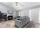 Comfortable living room featuring a fireplace, gray sofa, and ample natural light at 601 Southampton Dr, Knightdale, NC 27545
