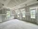 Spacious bedroom featuring three windows and drywall ready for finishing touches at 6505 Burnette Flower Way, Raleigh, NC 27612