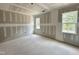 Bright bedroom features two windows, offering natural light, ready to be personalized and decorated at 6505 Burnette Flower Way, Raleigh, NC 27612