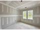 Cozy bedroom features two bright windows, perfect for creating a relaxing and personalized space at 6505 Burnette Flower Way, Raleigh, NC 27612
