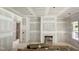 Large living room showcasing modern fireplace and stylish archway, ready for interior design at 6505 Burnette Flower Way, Raleigh, NC 27612