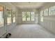 Sun-filled living room with large windows, offering ample natural light and views of the outdoors at 6505 Burnette Flower Way, Raleigh, NC 27612