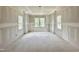 Expansive living room with multiple windows, creating a bright and airy atmosphere, ready for design at 6505 Burnette Flower Way, Raleigh, NC 27612