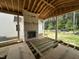 New porch under construction featuring wood framing and outdoor views at 6505 Burnette Flower Way, Raleigh, NC 27612