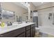 Bathroom features dual sinks, generous counter space, and a shower-tub combination at 6521 Sunset Manor Dr, Wake Forest, NC 27587
