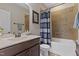 Bathroom with a single vanity, bath tub, and tiled shower and a modern design at 6521 Sunset Manor Dr, Wake Forest, NC 27587