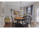 Cozy dining room features a wooden table with seating for six, complemented by stylish decor at 6521 Sunset Manor Dr, Wake Forest, NC 27587