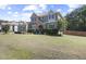 Beautiful home with a well-manicured lawn, stone accents, and lush landscaping for curb appeal at 6521 Sunset Manor Dr, Wake Forest, NC 27587