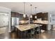 Spacious kitchen with a large center island, granite countertops, and stainless steel appliances at 6521 Sunset Manor Dr, Wake Forest, NC 27587