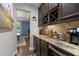 Charming kitchen nook with custom cabinetry, granite countertops and a built-in wine rack at 6521 Sunset Manor Dr, Wake Forest, NC 27587