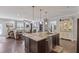 Open kitchen featuring a large island with bar seating, flowing into the living area at 6521 Sunset Manor Dr, Wake Forest, NC 27587