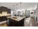 Spacious kitchen showcasing a large island, stainless steel appliances and an open floor plan at 6521 Sunset Manor Dr, Wake Forest, NC 27587