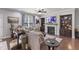 Comfortable living room features hardwood floors, a fireplace, and built-in shelving at 6521 Sunset Manor Dr, Wake Forest, NC 27587