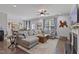 Spacious living room showcases a cozy fireplace, large windows, and a comfortable seating area at 6521 Sunset Manor Dr, Wake Forest, NC 27587