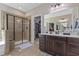 Modern main bathroom includes a glass-enclosed shower and a separate walk-in closet at 6521 Sunset Manor Dr, Wake Forest, NC 27587