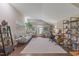 Open office space with hardwood floors, two sofas, two desks, and decor at 6521 Sunset Manor Dr, Wake Forest, NC 27587