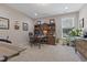 Well-appointed office with custom built-ins, a large desk, and natural light at 6521 Sunset Manor Dr, Wake Forest, NC 27587