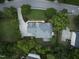 Aerial top shot showcasing a home with a pristine lawn, mature trees and inviting driveway, perfect for outdoor living at 704 Walcott Way, Cary, NC 27519