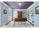 Cozy home office with built-in shelving, wooden desk, hardwood floors, and neutral colors at 704 Walcott Way, Cary, NC 27519