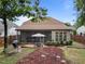 Backyard featuring a screened porch, seating, and manicured landscaping at 7768 Berry Crest Ave, Raleigh, NC 27617