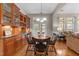Cozy dining area featuring a built-in cabinet and access to the backyard, perfect for everyday meals at 7768 Berry Crest Ave, Raleigh, NC 27617