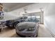 Two-car garage featuring an automatic door, overhead storage, and epoxy flooring at 7768 Berry Crest Ave, Raleigh, NC 27617