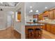Well-designed kitchen with granite countertops, stainless steel appliances, and a breakfast bar with seating at 7768 Berry Crest Ave, Raleigh, NC 27617
