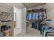 Spacious walk-in closet with ample shelving and rod space for organized storage at 7768 Berry Crest Ave, Raleigh, NC 27617