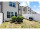 Cozy backyard featuring well-maintained landscaping and a white privacy fence at 7807 Elmshire Way, Raleigh, NC 27616