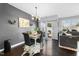 Cozy dining area with modern lighting, stylish decor, and access to the backyard at 7807 Elmshire Way, Raleigh, NC 27616