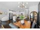 Bright open floor plan connecting the dining area to the kitchen for seamless entertaining at 7807 Elmshire Way, Raleigh, NC 27616
