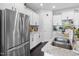 The stainless-steel refrigerator and double sink enhance this kitchen's functionality and modern appeal at 7807 Elmshire Way, Raleigh, NC 27616