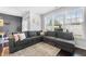Comfortable living room featuring a large sectional sofa and bright windows at 7807 Elmshire Way, Raleigh, NC 27616