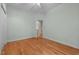 Bedroom featuring hardwood floors and private balcony access at 7918 Dairy Ridge Rd, Mebane, NC 27302