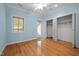 Bedroom featuring hardwood floors and private balcony access at 7918 Dairy Ridge Rd, Mebane, NC 27302